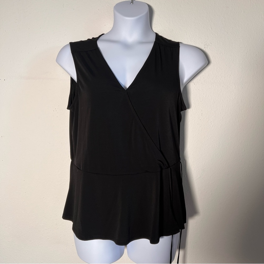 NWT Black Faux Wrap top with decorative waist tie. Flattering v-neck wrap cut